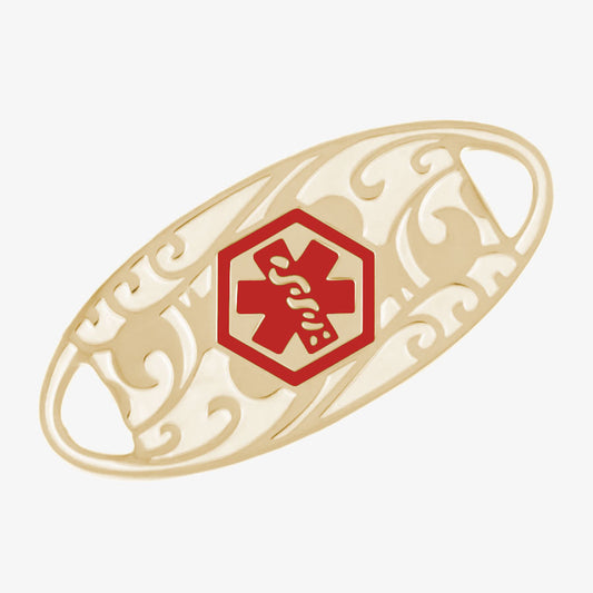 Oval-shaped gold-tone stainless steel medical alert tag with red medical symbol and scrolling filigree pattern