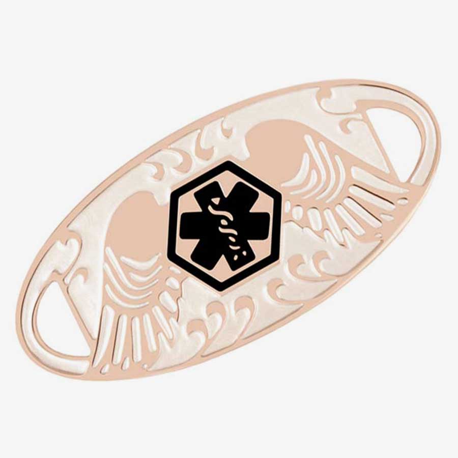 Rose gold medical ID tag with decorative angel wings and contrasting black medical caduceus symbol