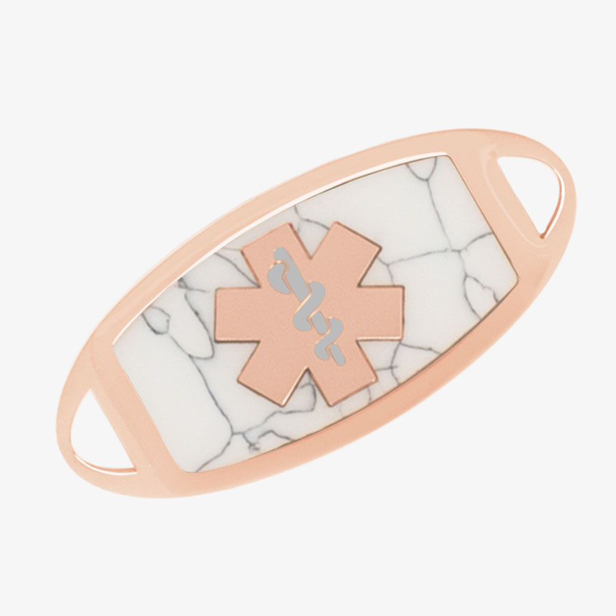 Rose gold tone medical ID tag with marbled howlite inlay and rose gold tone medical symbol at the center.