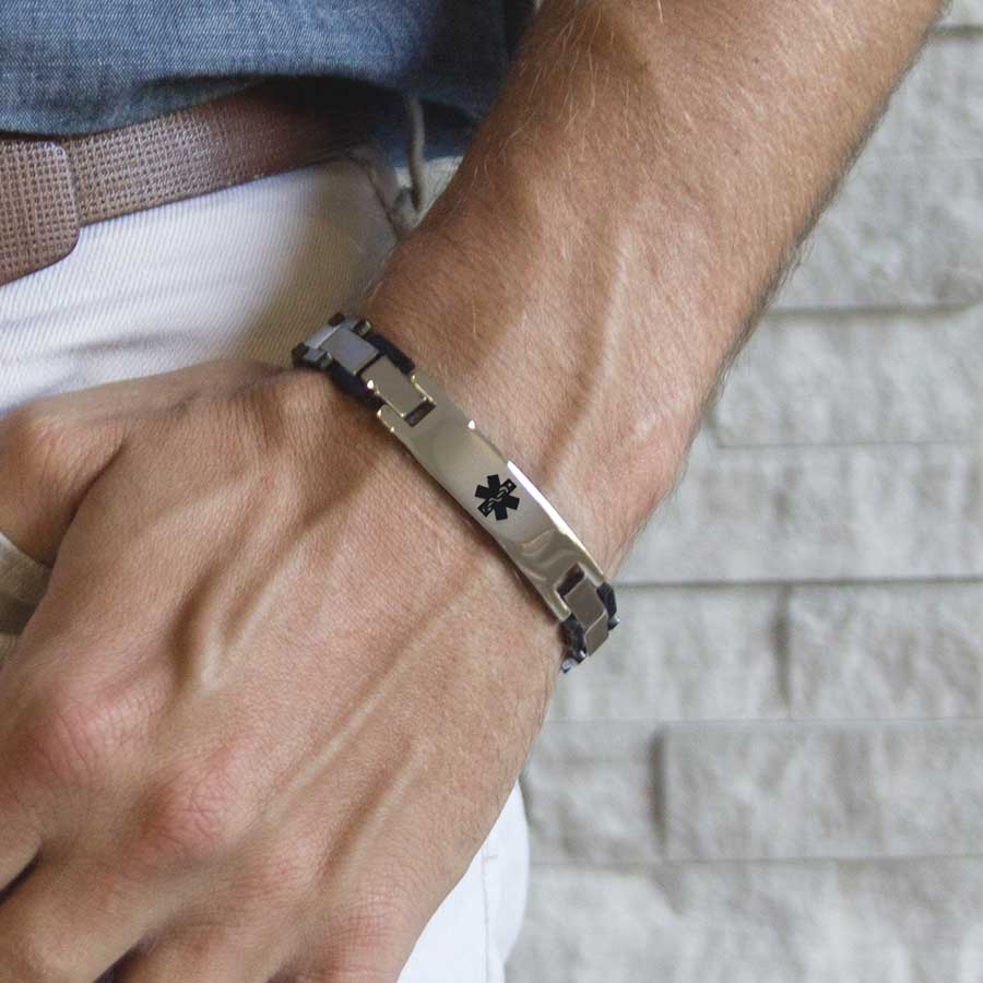 Man wearing the Ryder Medical ID Bracelet, a blend of stainless black and steel finished links, affixed tag, black caduceus