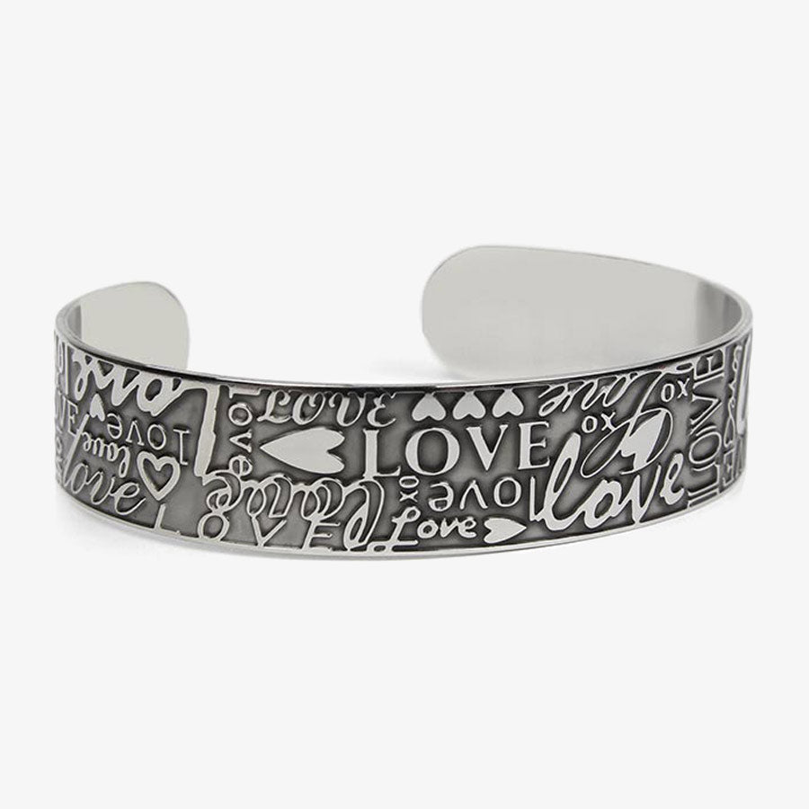 Front of Love Medical ID Cuff with embossed hearts, XO hugs and kisses, the word, &quot;LOVE,&quot; in varied prints and scripts