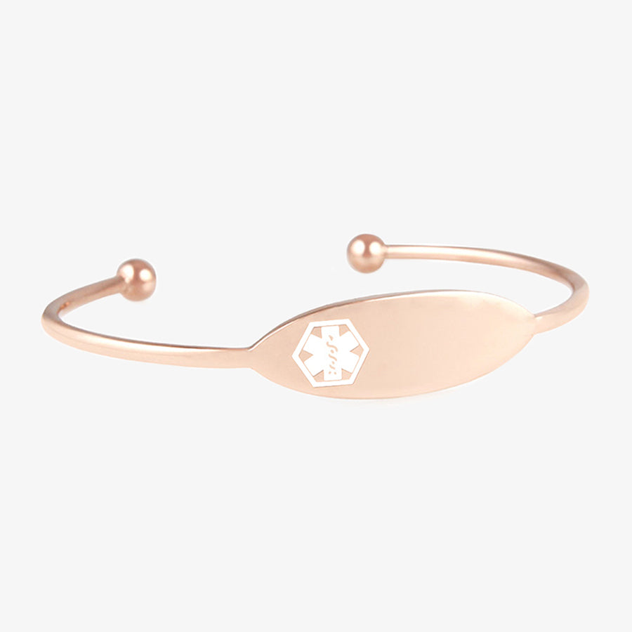 Thin rose gold tone cuff with white medical symbol