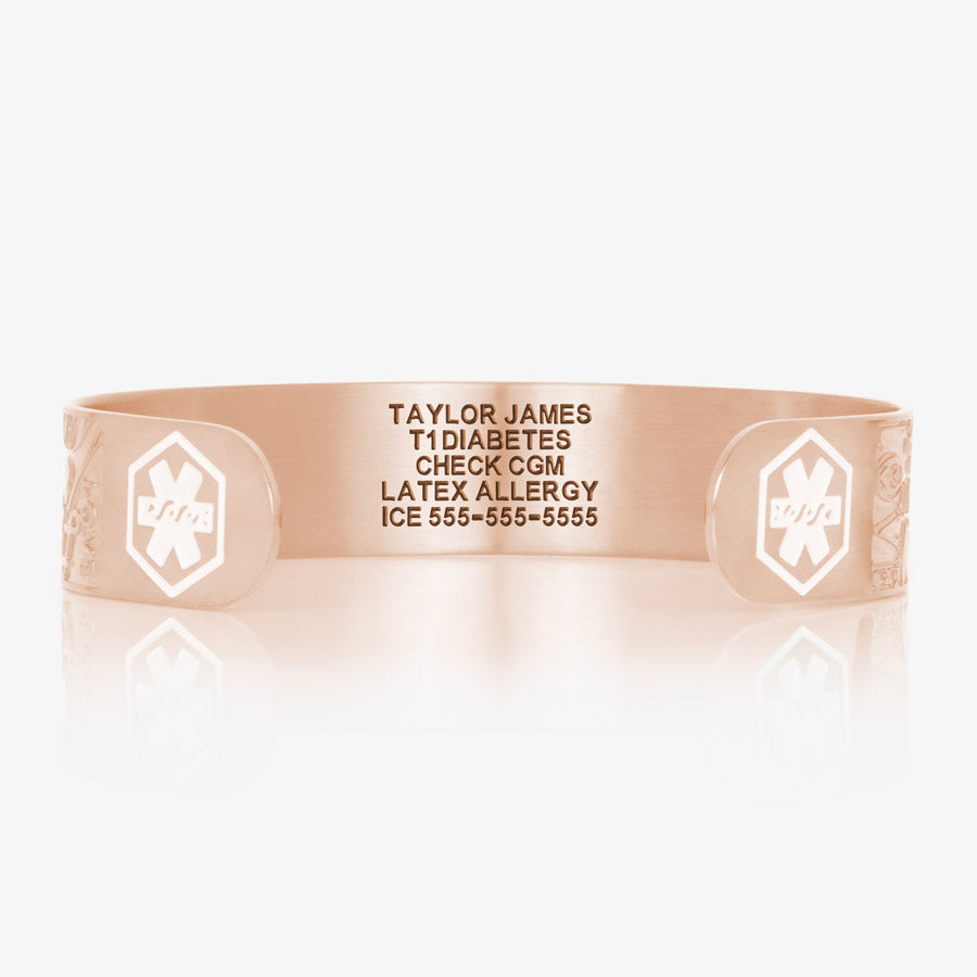 Front of medical alert bracelet in rose gold with white medical symbols and custom laser engraving