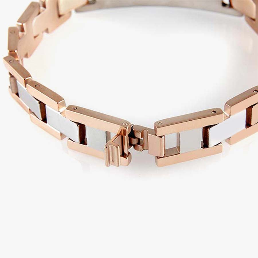 The slip-thru clasp of the Sawyer Medical ID Bracelet, a blend of rose gold tone and stainless finished links and affixed tag