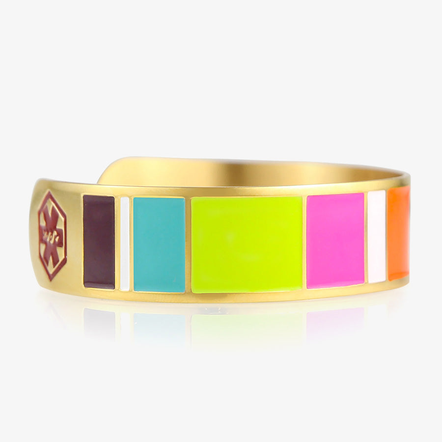 Key West Medical ID Cuff.  Orange pink white magenta lime navy and teal color blocks,yellow gold background, red caduceus