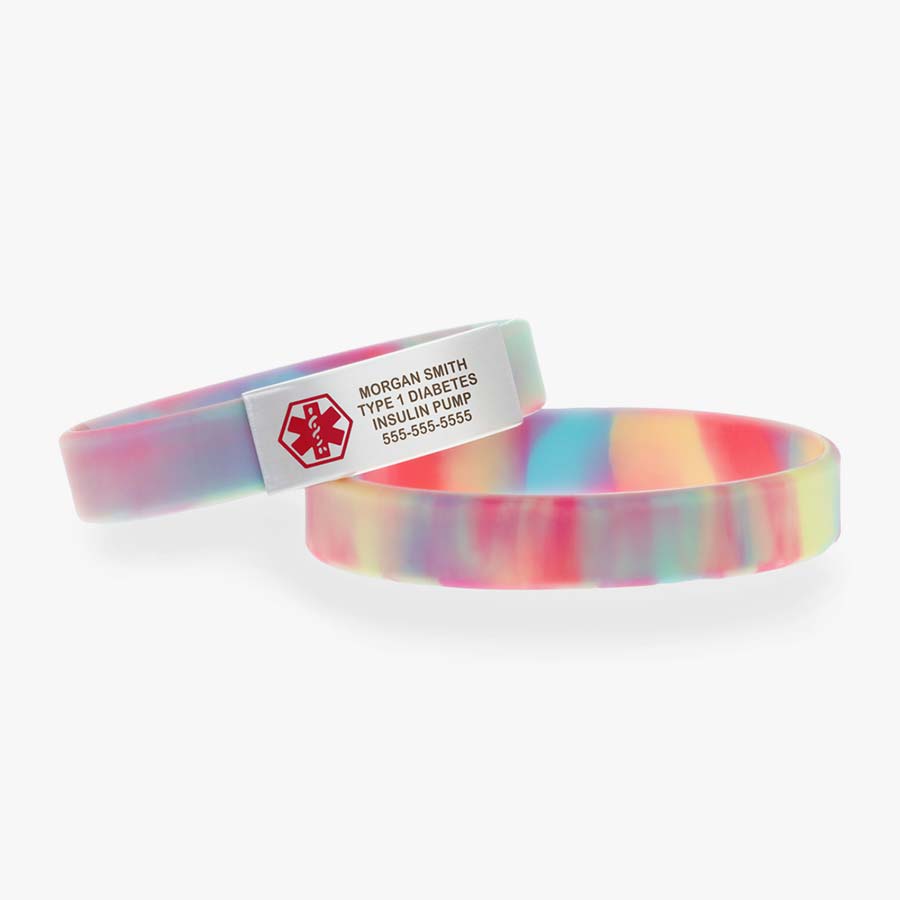 Stacked pair of tie dye activewear sport bracelets with silver medical alert tag with red symbol.