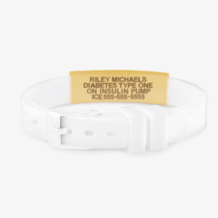 White buckle clasp on white silicone medical alert bracelet with brushed gold medical ID tag