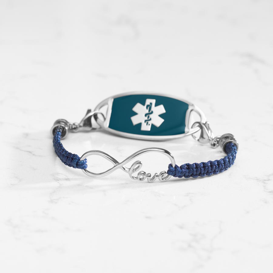 Navy blue macrame medical ID bracelet with silver infinity center piece with the word love, paired with stainless steel medical ID tag with blue inlay and silver caduceus