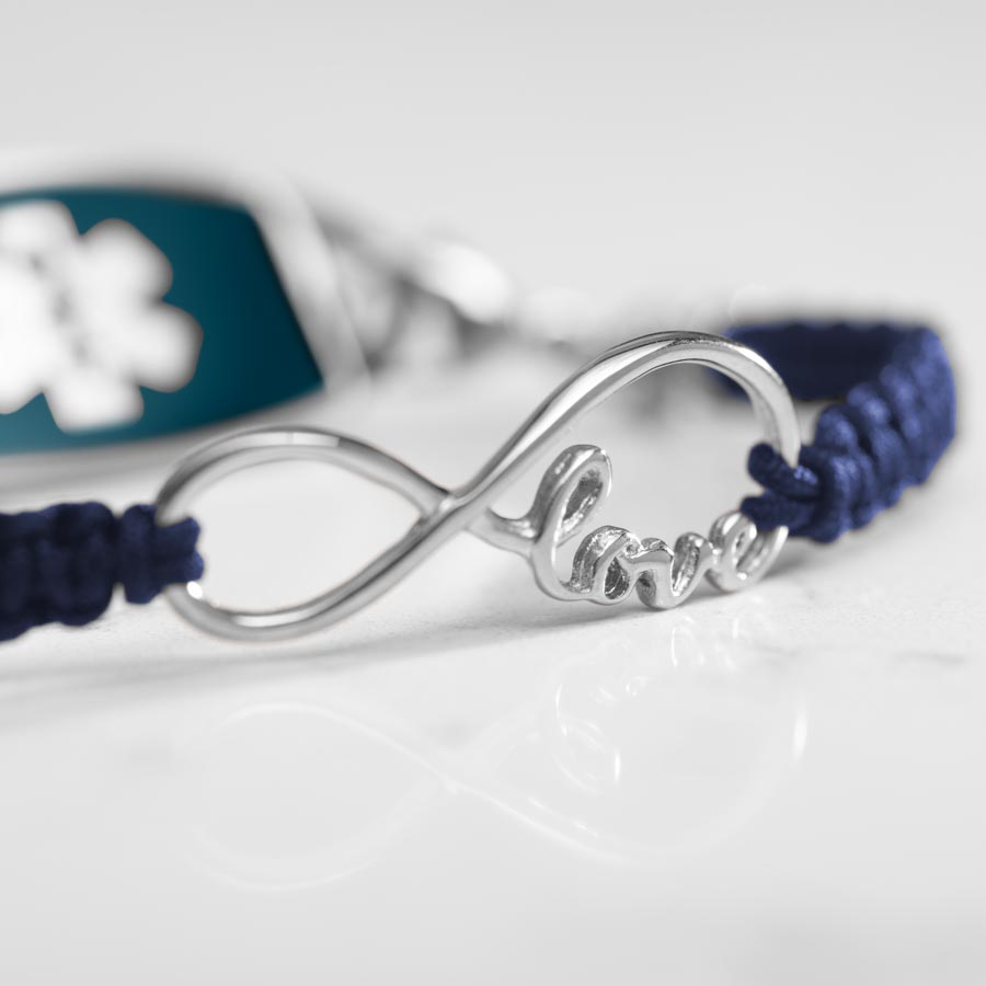 Close up Detail of silver infinity center piece with the word love