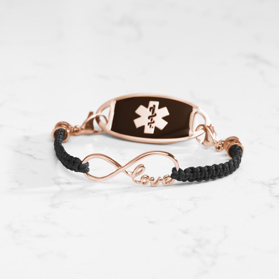 Black macrame medical ID bracelet with Rose Gold infinity center piece with the word love, paired with stainless steel medical ID tag with Black inlay and Rose Gold caduceus