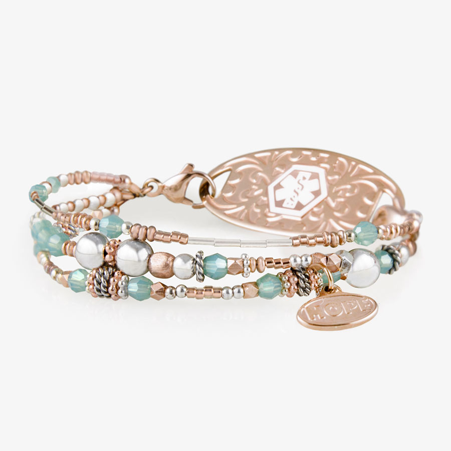 Interchangeable multi strand bracelet: Sterling silver, crystal, and rose gold tone beads attached to rose gold tone medical ID tag