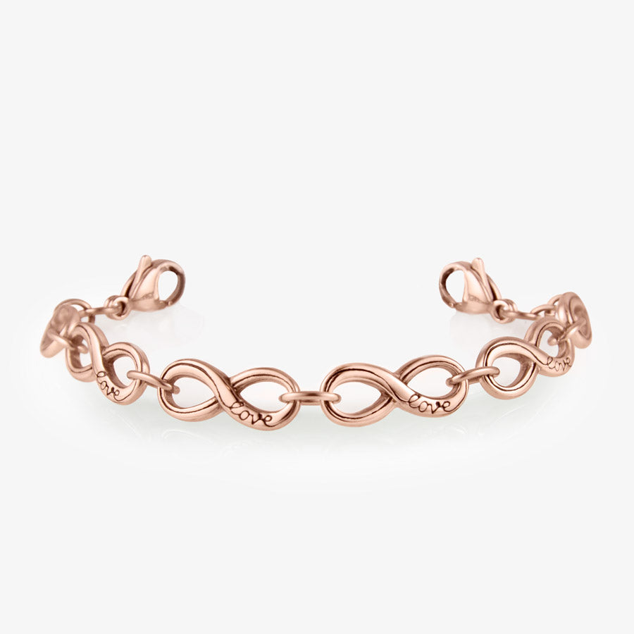 Interlocking rose gold tone infinite symbols make a single chain that attaches to a medical ID tag.