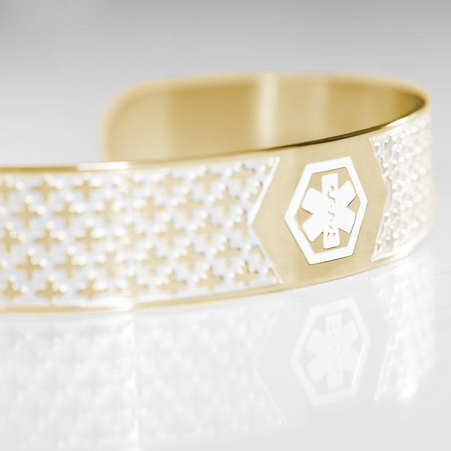 Close up detail image of cross design on Mae Gold Med ID Cuff Bracelet.