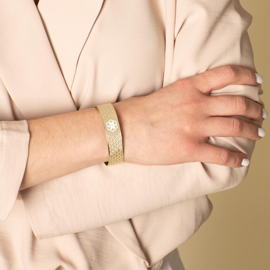 Woman wearing Mae Gold Med ID Cuff