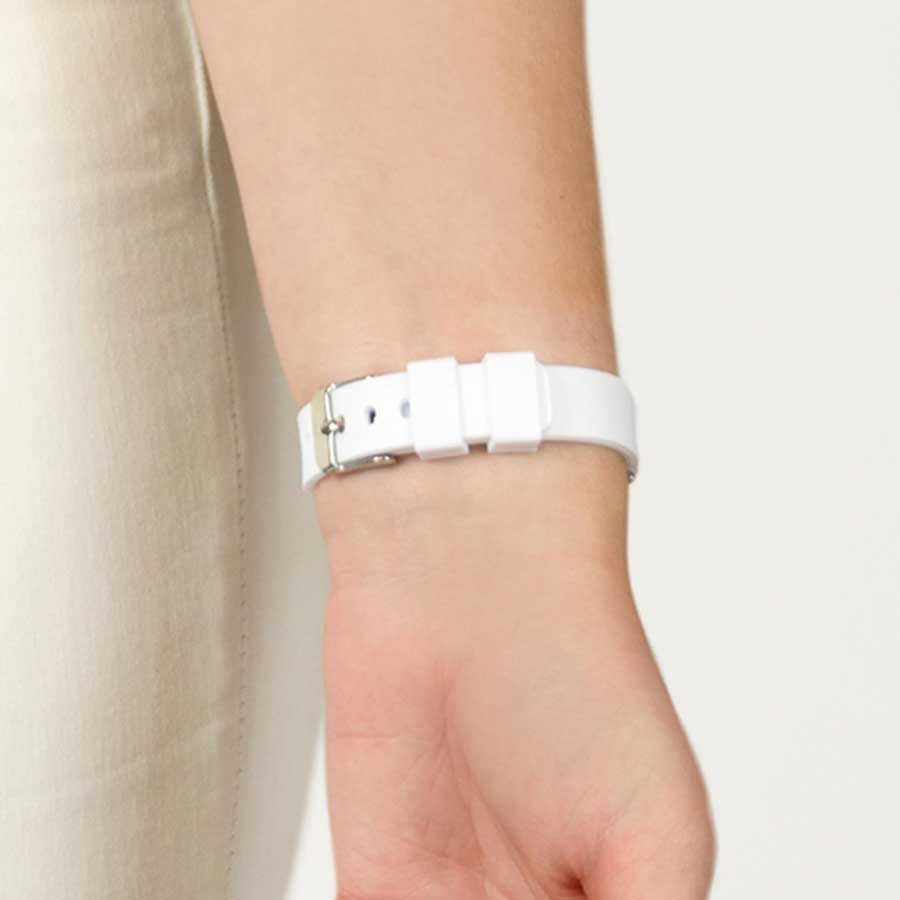 Woman showing back of silicone medical ID bracelet clasp