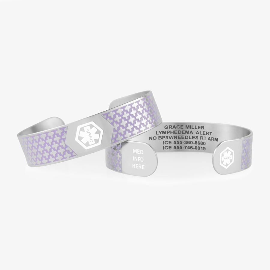 Two silver and lavender patterned medical ID cuffs stacked to show white medical symbols at the center and the end of the cuff.