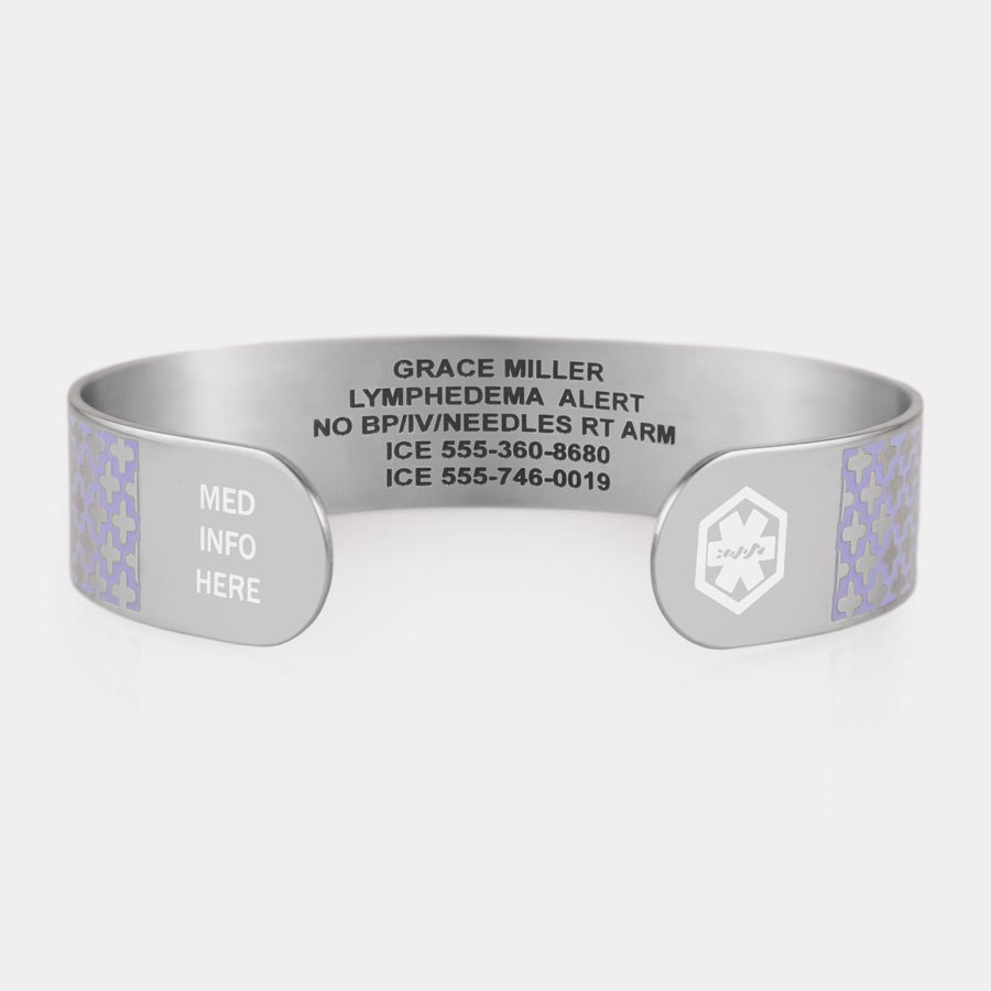 Silver tone medical ID cuff bracelet with lavender pattern and white medical symbol at one end, med info here at other end, and engraving.