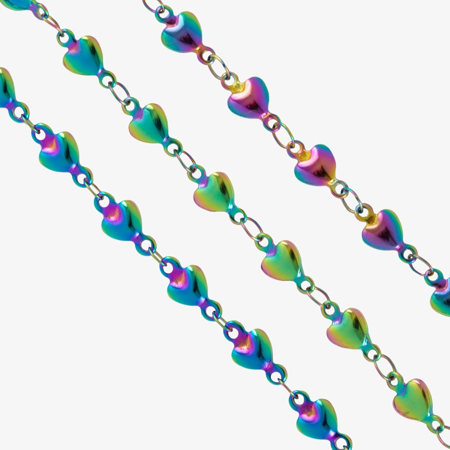 Overhead variation shot of multi colored magic finish stainless steel heart link chain medical ID bracelet.