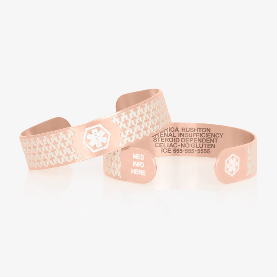 Rose gold tone stainless steel medical alert cuff bracelet with pearlescent inlay on with cross detailed pattern and white medical symbols and "med info here."