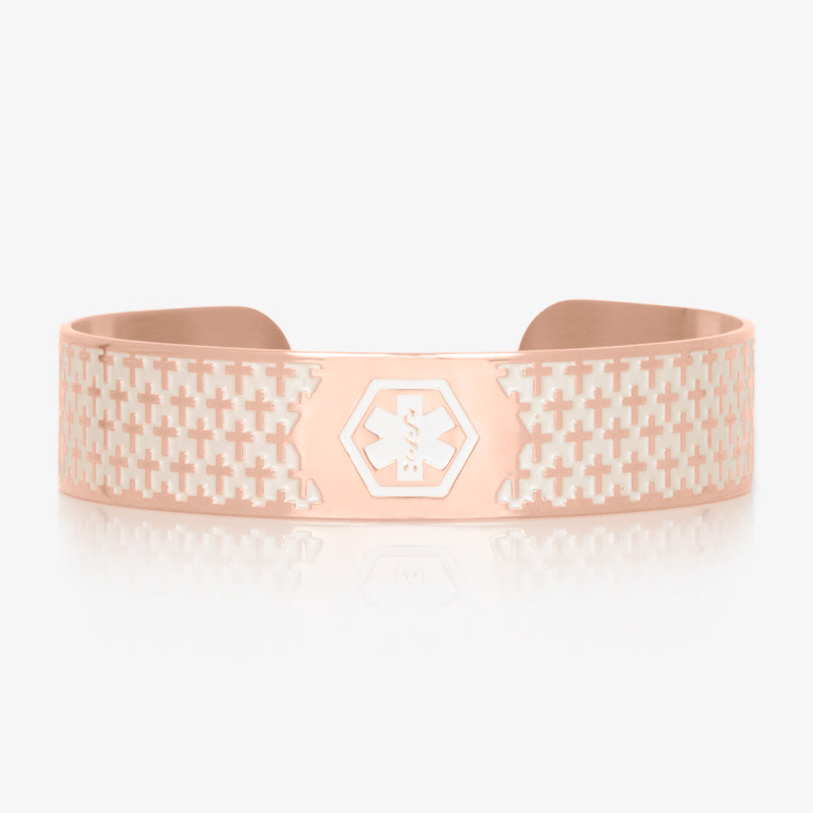 Rose gold tone stainless steel medical alert cuff bracelet with pearlescent inlay on with cross detailed pattern and white medical symbol.&quot;