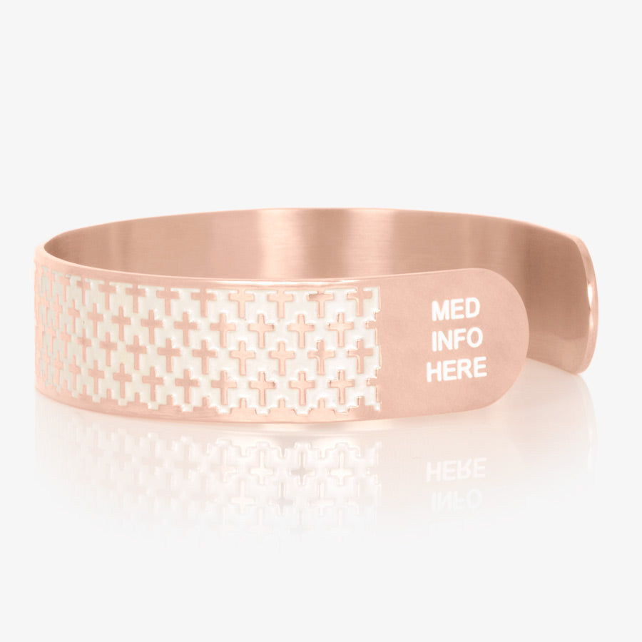 Rose gold tone stainless steel medical alert cuff bracelet with pearlescent inlay on with cross detailed pattern and white "med info here."