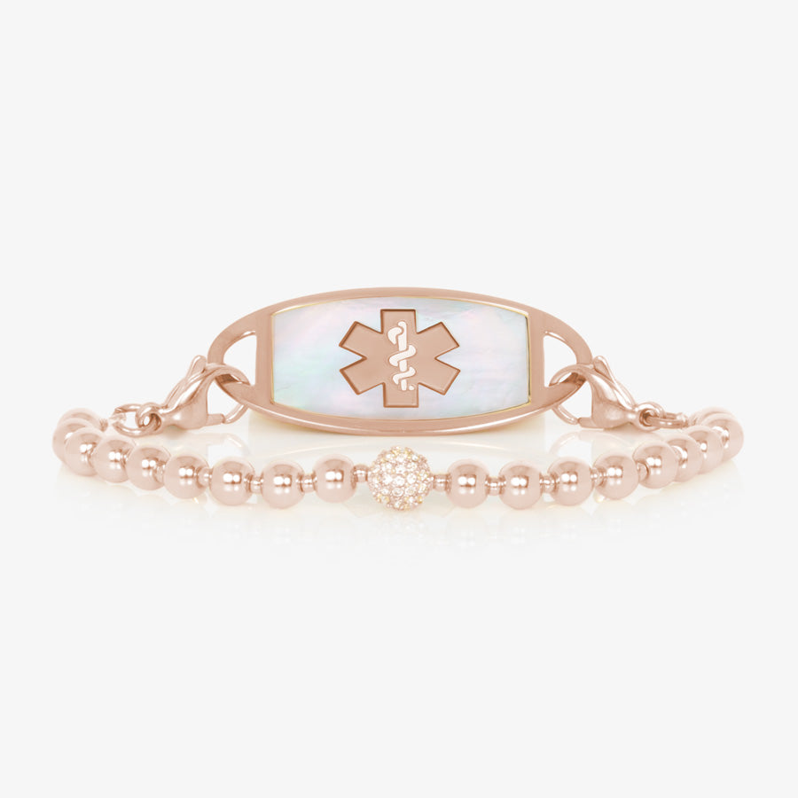 Rose gold beaded stretch medical ID bracelet with pave crystal centerpiece and mother of pearl medical alert tag