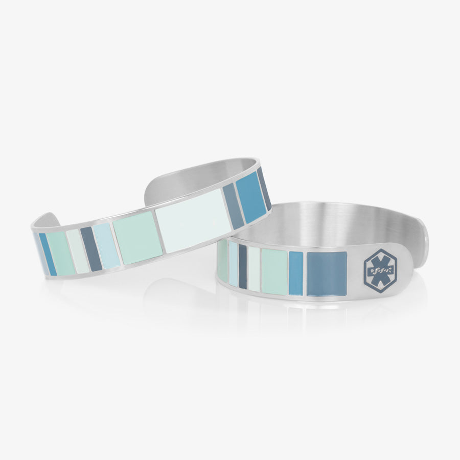 Color block medical ID cuff bracelet with varying shades of blues with blue medical caduceus symbols