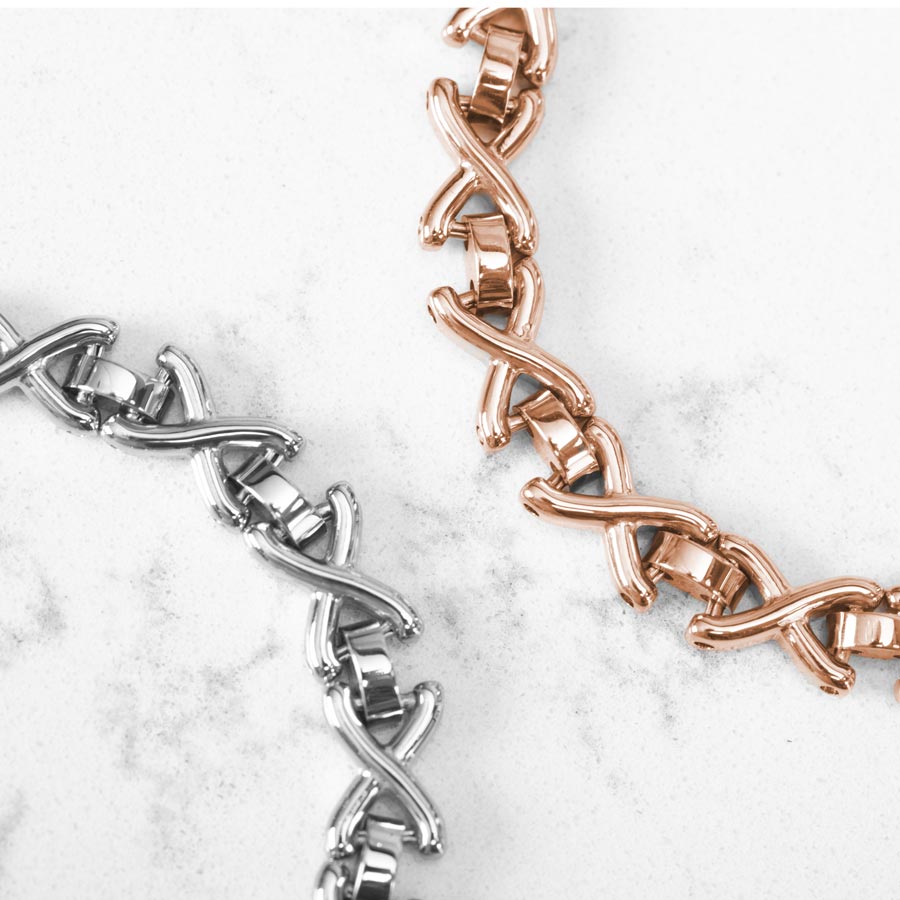 Lennox Medical ID Chain Bracelet displayed in silver and rose on a marble countertop.