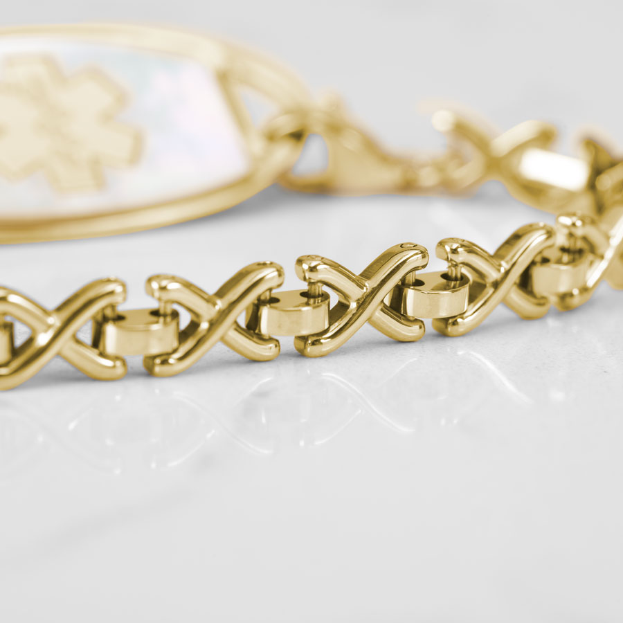 Close up of X-shaped links on gold tone Lenox Medical ID Bracelet