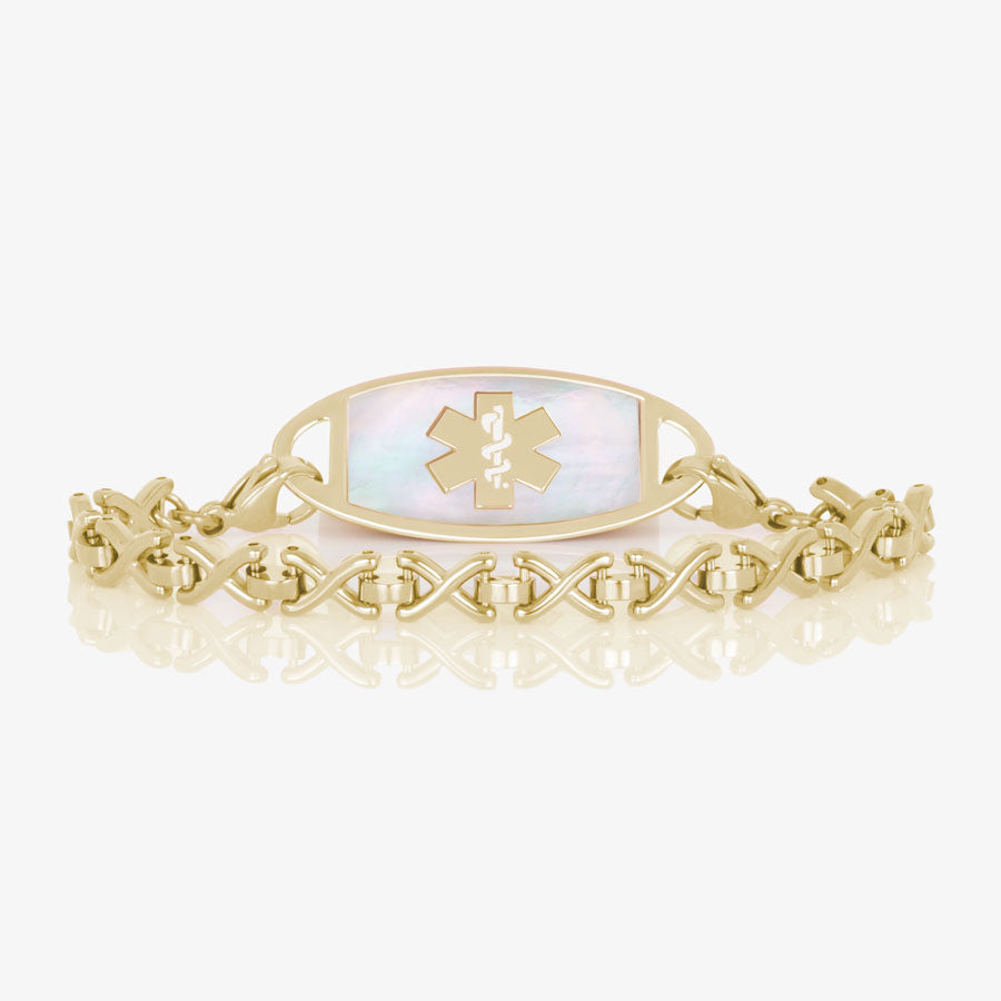 Lenox Medical ID Bracelet featuring X-shaped links in gold tone stainless steel, attached to gold medical ID tag with inlaid Mother of Pearl