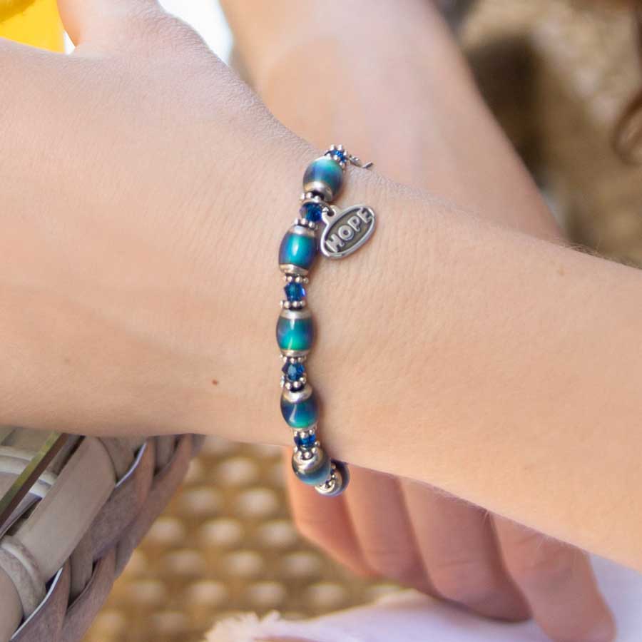 Color-changing mood beads with stainless steel and Blue Swarovski crystal accents interchangeable ID bracelet on wrist