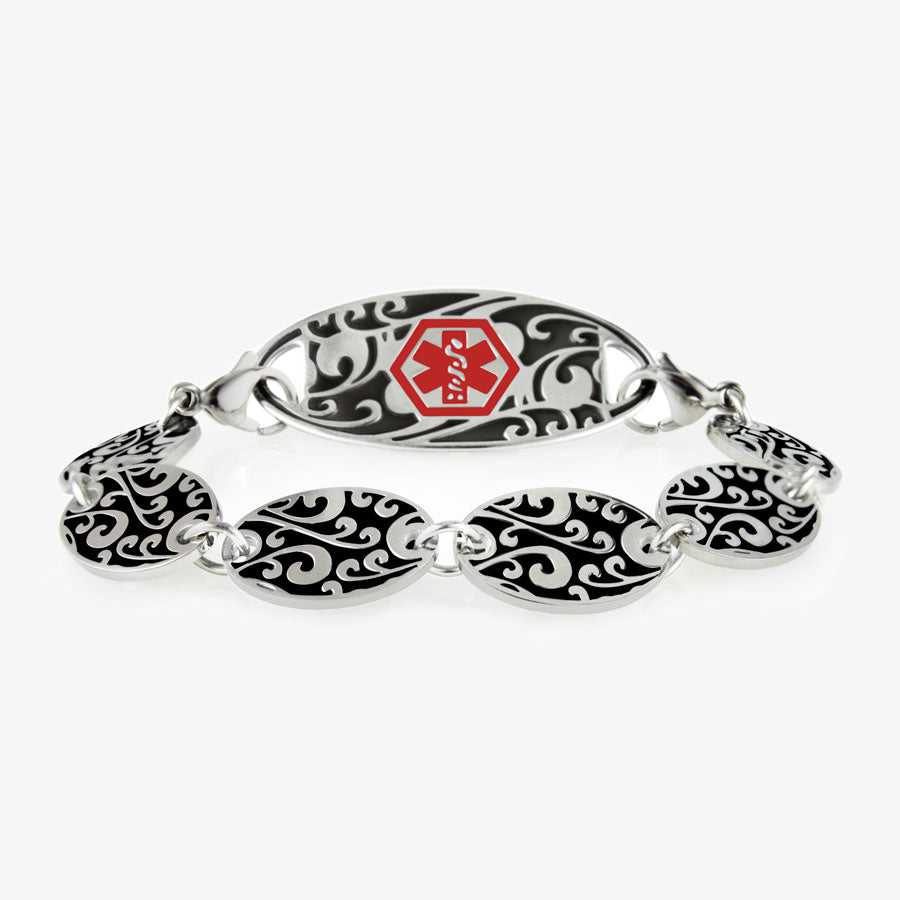 Decorative chain bracelet with circular patterned links and intricate medical alert tag