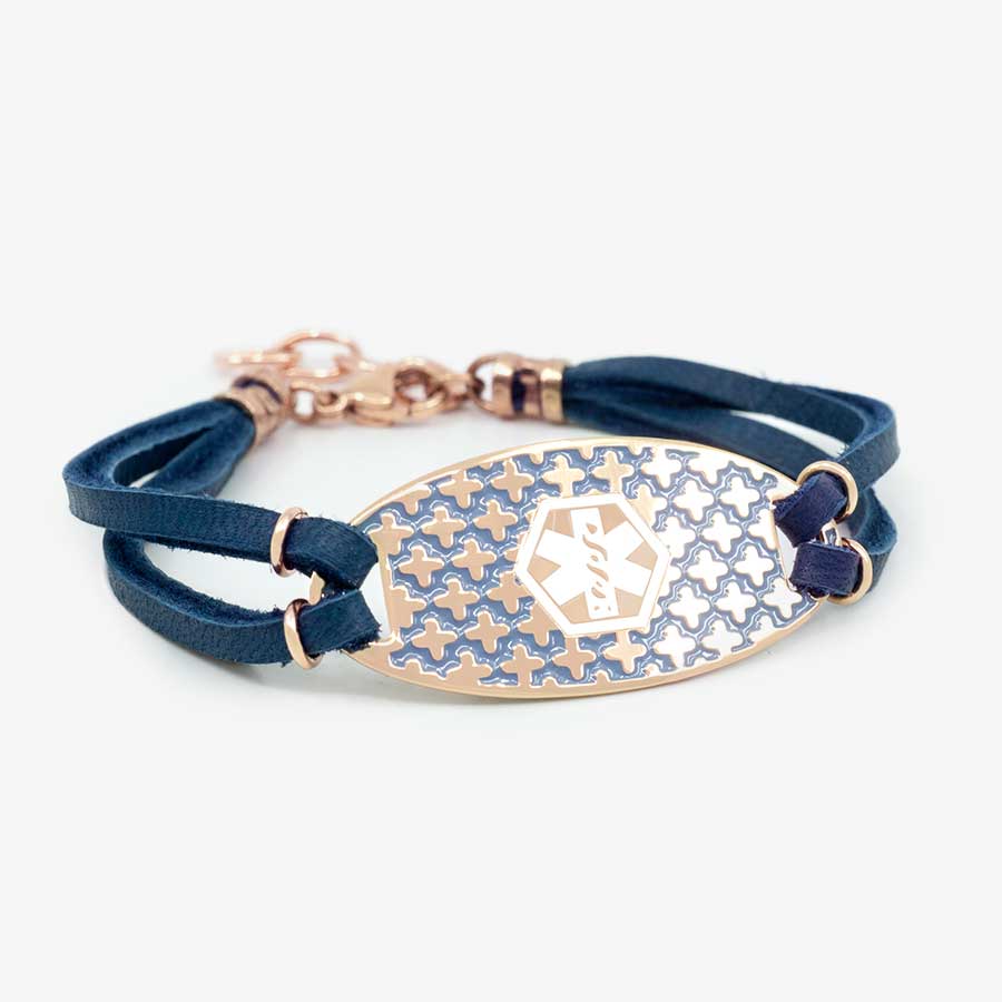 Rose gold medical ID tag with decorative inlay on medical ID bracelet with navy blue suede