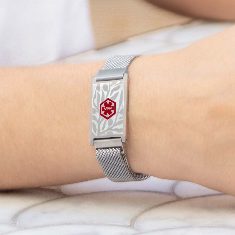 Woman wearing mesh medical alert bracelet with magnetic clasp