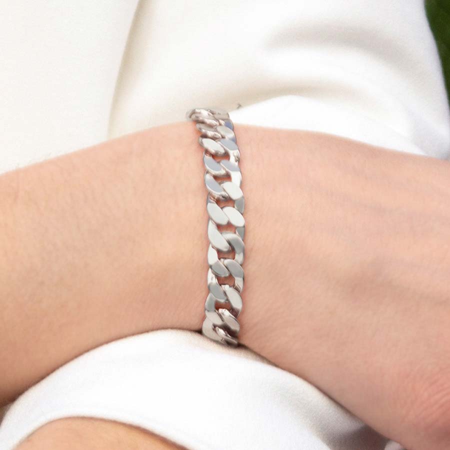 Woman wearing sterling silver curb chain with faceted links 