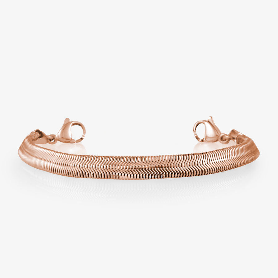 Overhead shot of rose gold herringbone medical ID bracelet strand on white background.