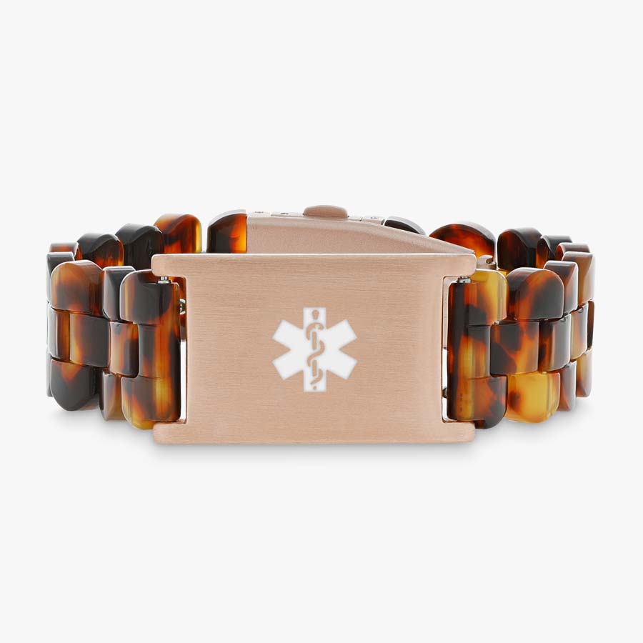 Tortoiseshell and rose gold medical ID bracelet with resin band.