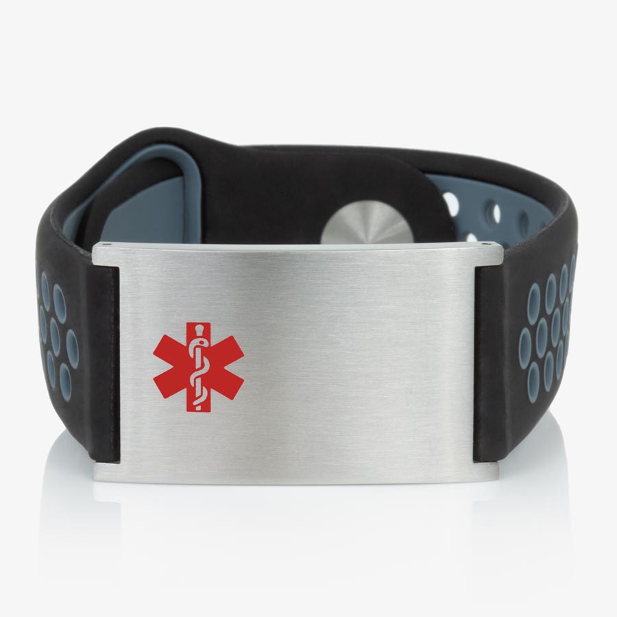 Low front angle of black and grey perforated silicone band with adjustable strap and a brushed silver tag with red caduceus symbol. 