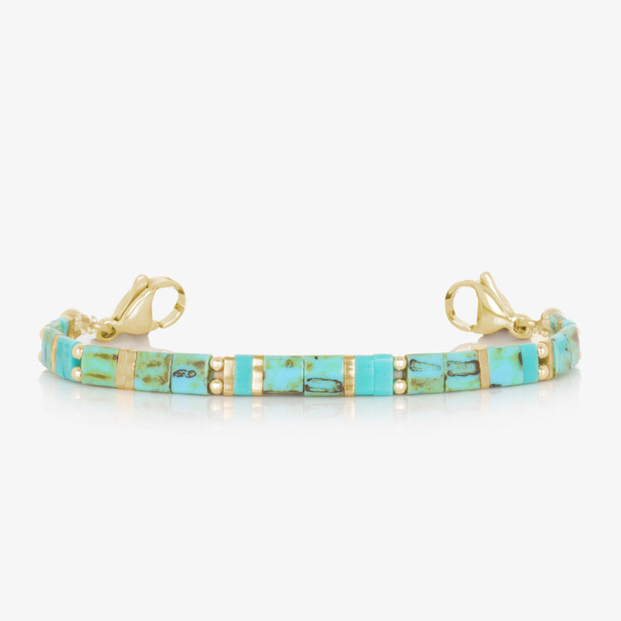 Turquoise and gold tone beaded stretch medical alert bracelet.