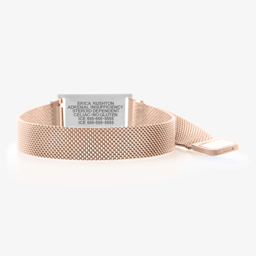 Open magnetic clasp on rose gold mesh band with silver laser engraved medical ID tag