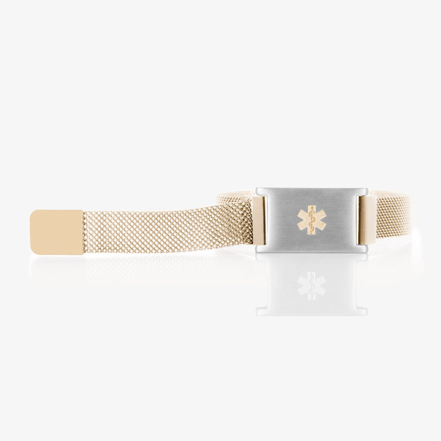 Sandstone stainless steel mesh band with affixed stainless steel with gold tone medical symbol at the center with the band opened.