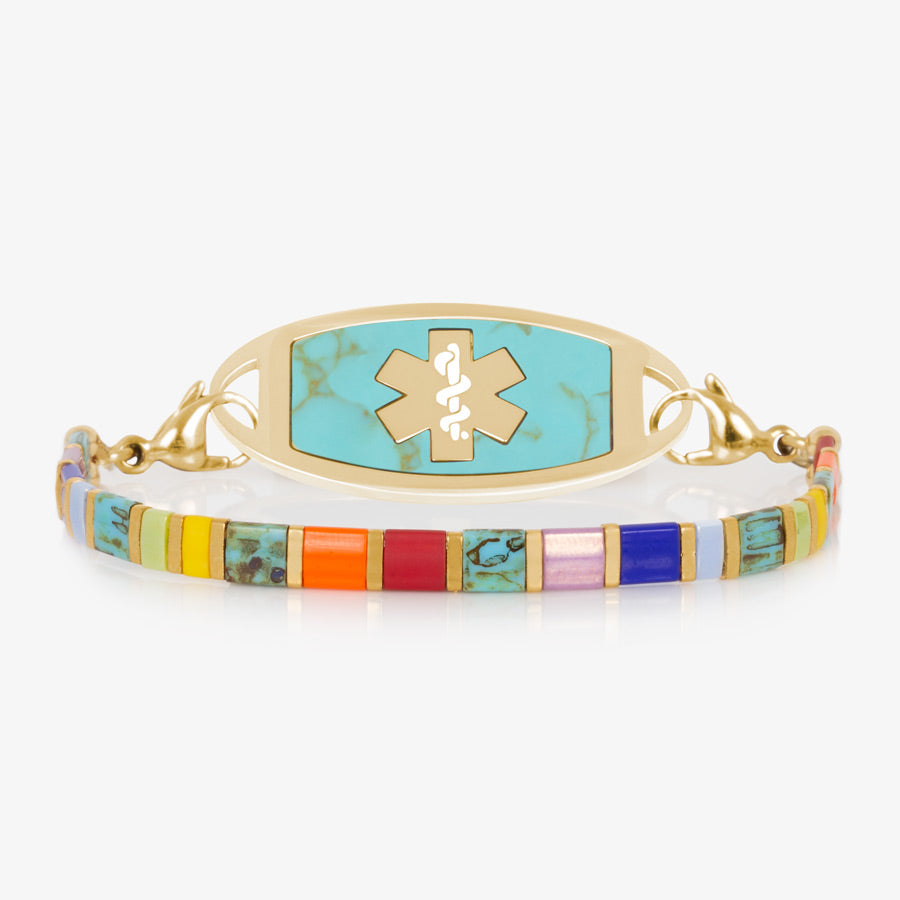 Multicolored stretch medical ID bracelet with orange, blue, and gold accents featuring a Turquoise and Gold ID Tag.