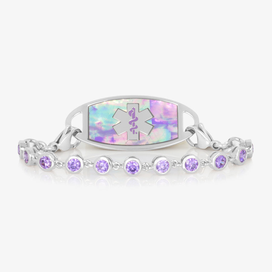 Silver tone bracelet with round violet colored crystals paired with stainless steel medical ID tag with lilac abalone inlay and silver tone medical symbol.