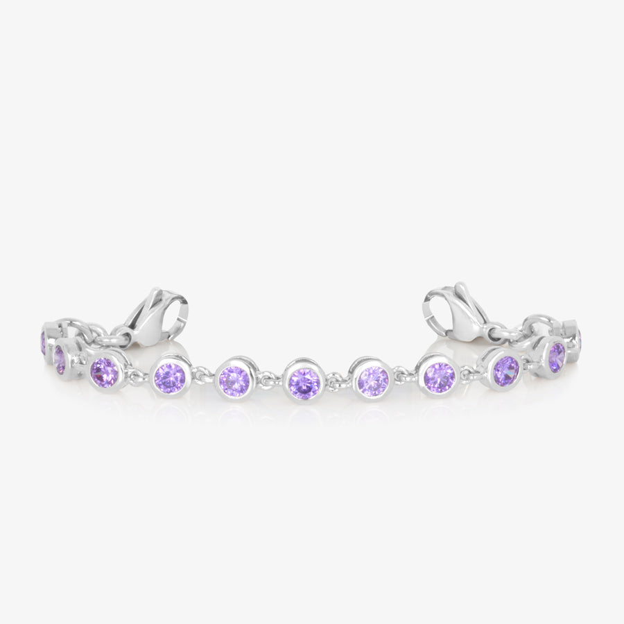 Silver tone bracelet with round violet colored crystals finished with stainless steel lobster clasps at each end.