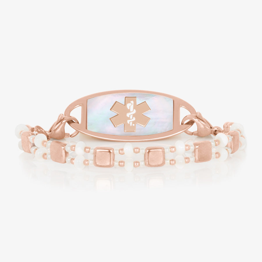 Rose gold and mother of pearl tile beaded stretch medical alert bracelet paired with rose gold tone stainless steel medical ID tag with mother of pearl inlay and rose gold tone medical symbol.