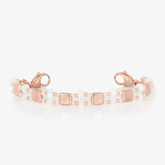 Rose gold and mother of pearl tile beaded stretch medical ID bracelet finished with rose gold tone stainless steel lobster clasps at each end.