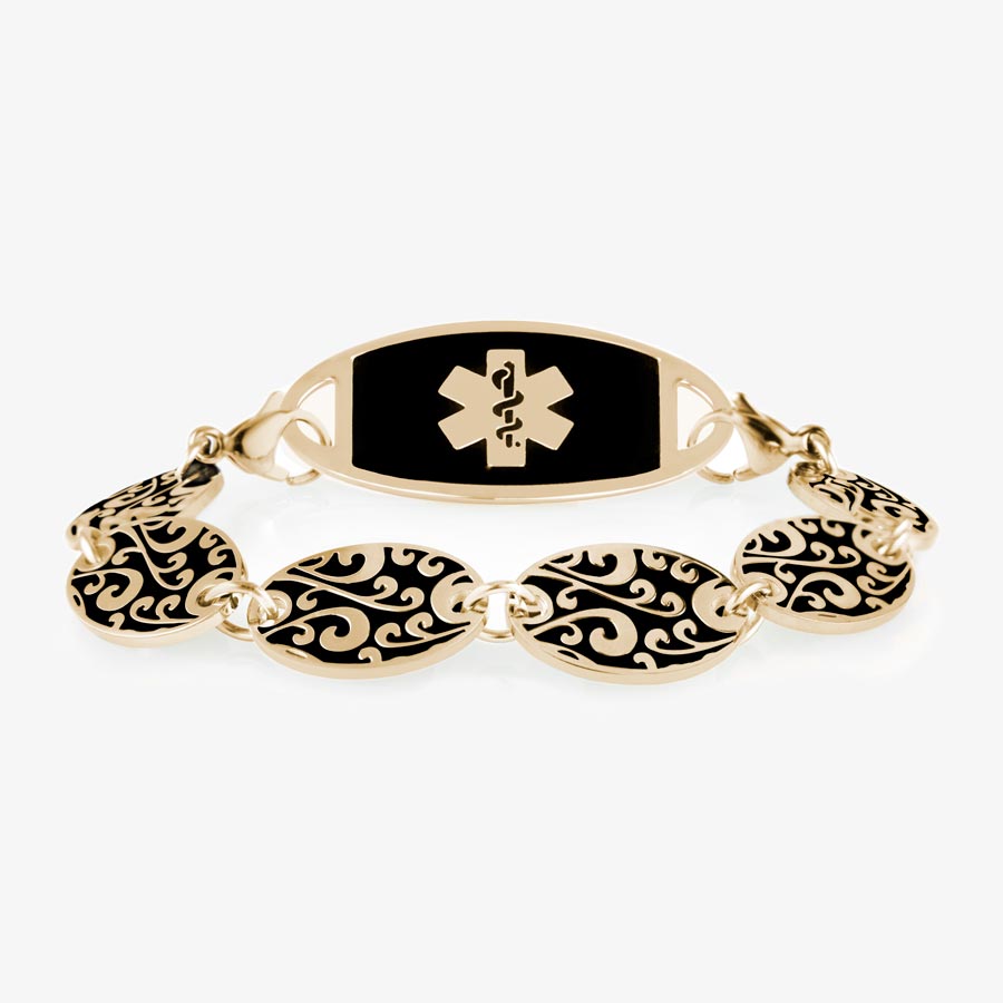 Gold Tone Decorative chain bracelet with circular patterned links and black and gold tone medical alert tag.