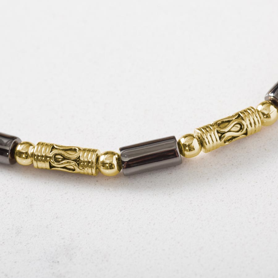 Close up image of 12k gold plated and hematite beads.