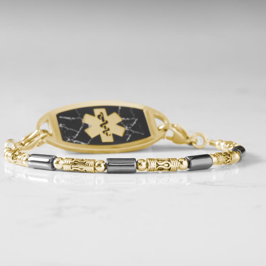 12k gold plated and hematite beaded stretch medical alert bracelet paired with gold tone stainless steel ID tag with black inlay and gold tone medical caduceus symbol.