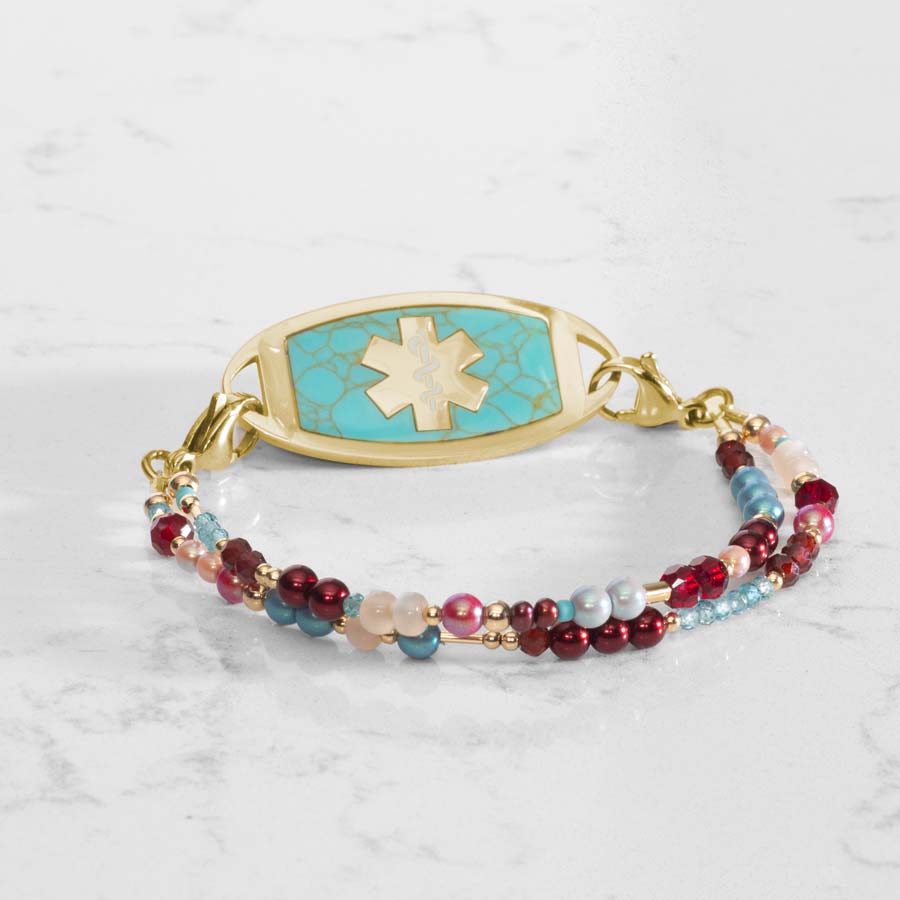 Dahlia Beaded Medical ID bracelet with Gold and Turquoise Medical ID tag on white marble counter